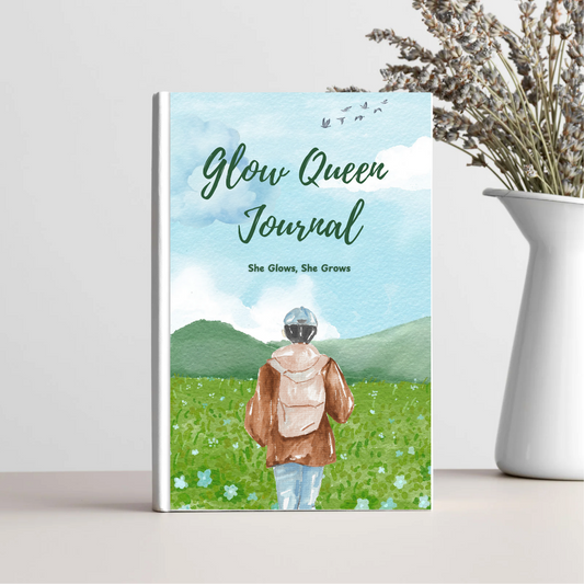 Glow Queen Guide daily self-love journal for women with a nature-themed watercolor cover featuring a woman in a field